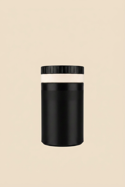 Despolvillador negro con fondo beige sin sombras